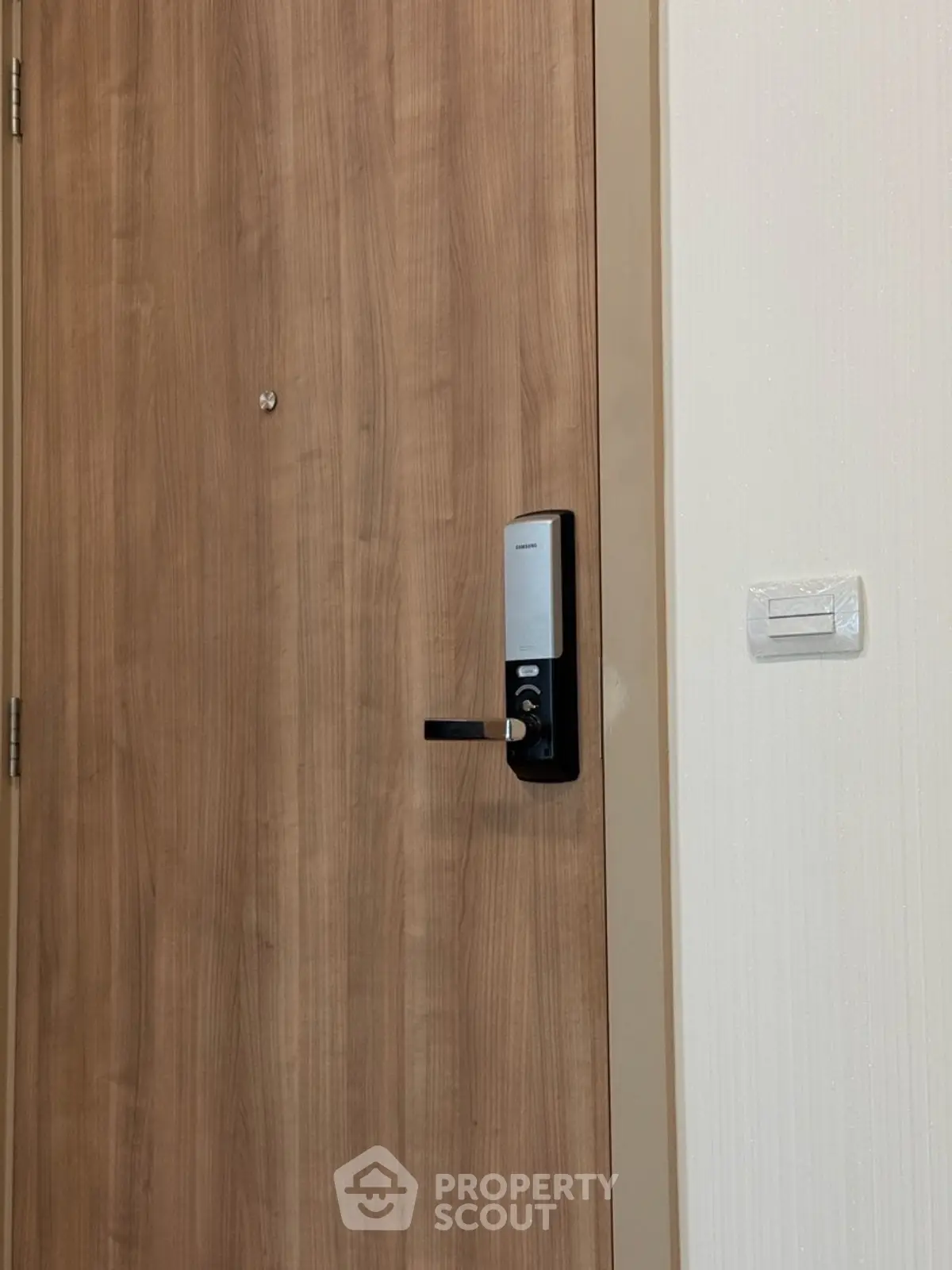 Modern wooden door with digital lock in a contemporary apartment