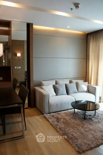 Modern living room with cozy sofa and elegant decor in a stylish apartment.