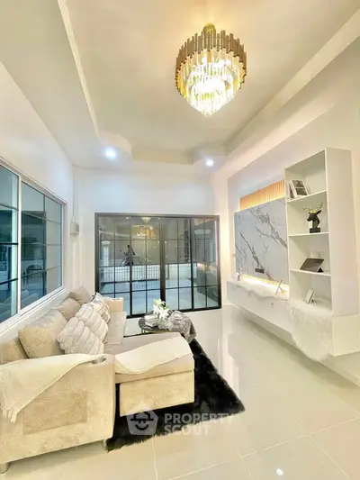 Luxurious living room with elegant chandelier and modern decor