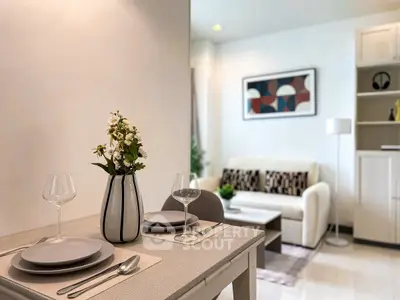 Modern living room with elegant dining setup and stylish decor