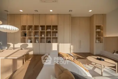 Modern living room with elegant wooden cabinetry and stylish decor