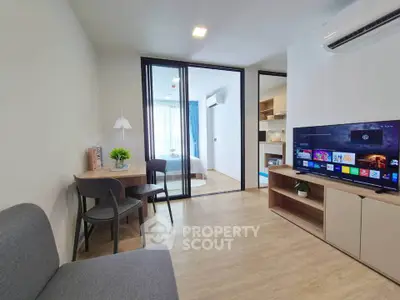 Modern living room with open layout, stylish furniture, and natural light, perfect for urban living.