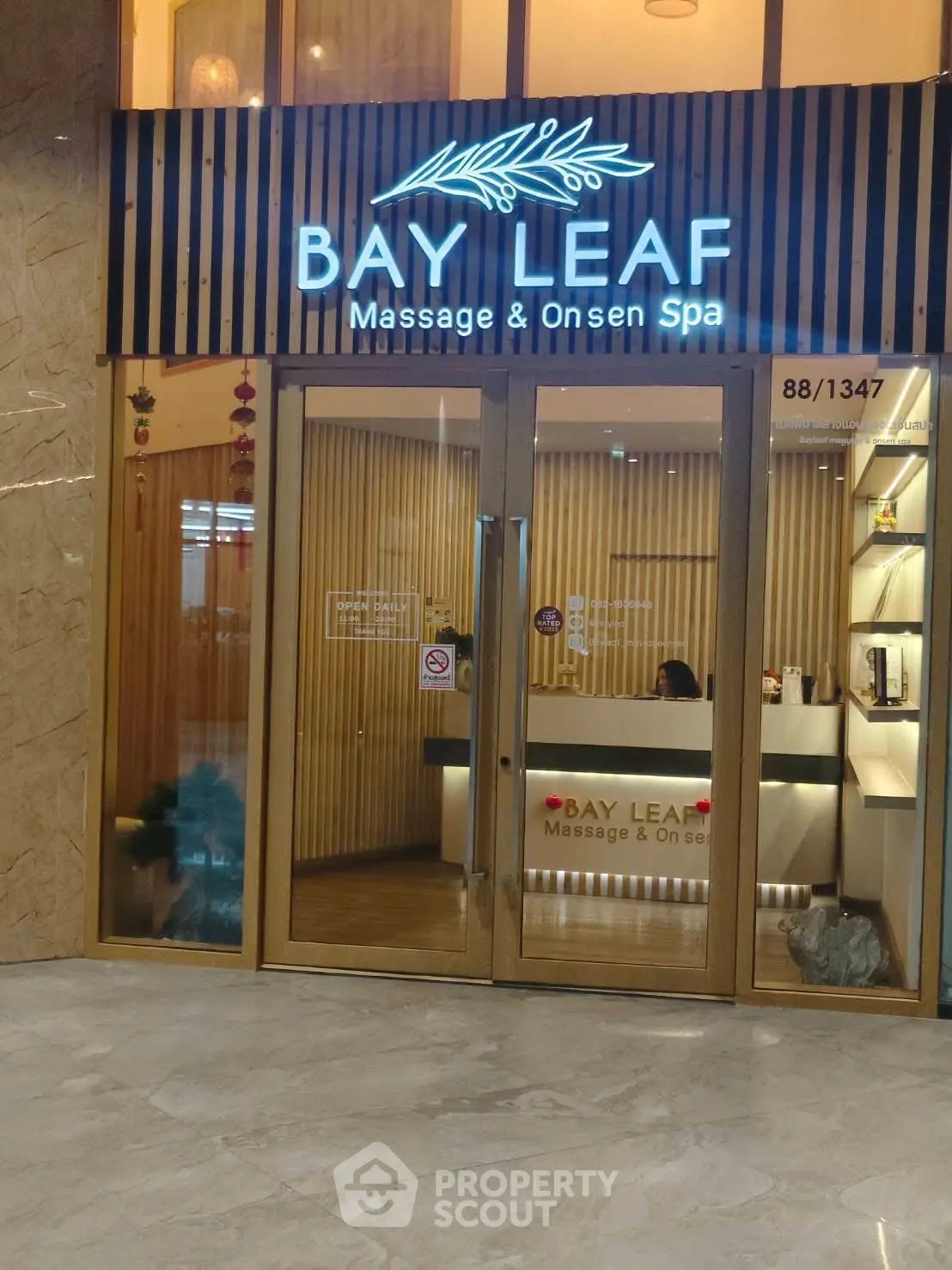 Elegant spa entrance with modern glass doors and inviting reception area.