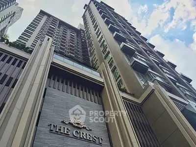 Stunning view of The Crest luxury high-rise building against a blue sky.