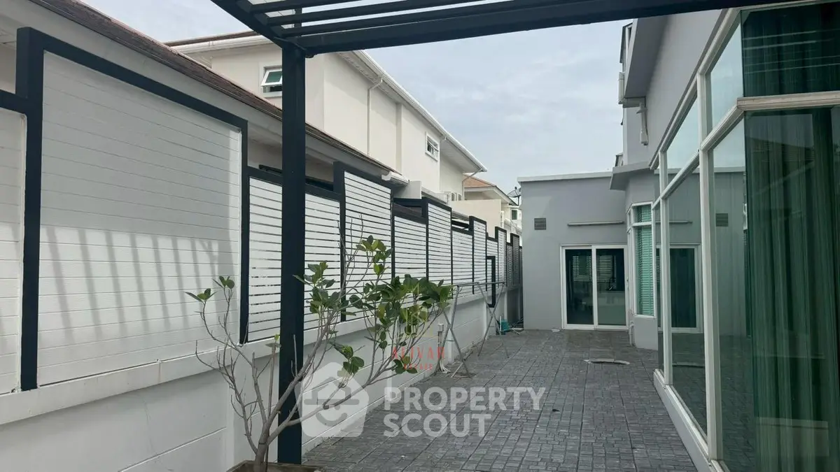 Modern exterior patio with sleek design and glass doors