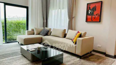 Spacious modern living room with large windows and stylish decor