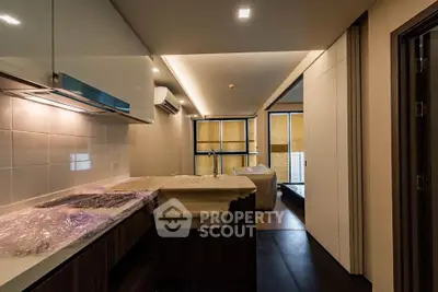 Modern kitchen with sleek design and open layout in contemporary apartment