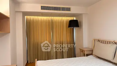 Cozy bedroom with elegant lighting and modern decor