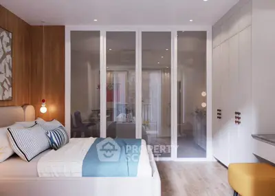 Modern bedroom with stylish decor and glass partition leading to a cozy living area.