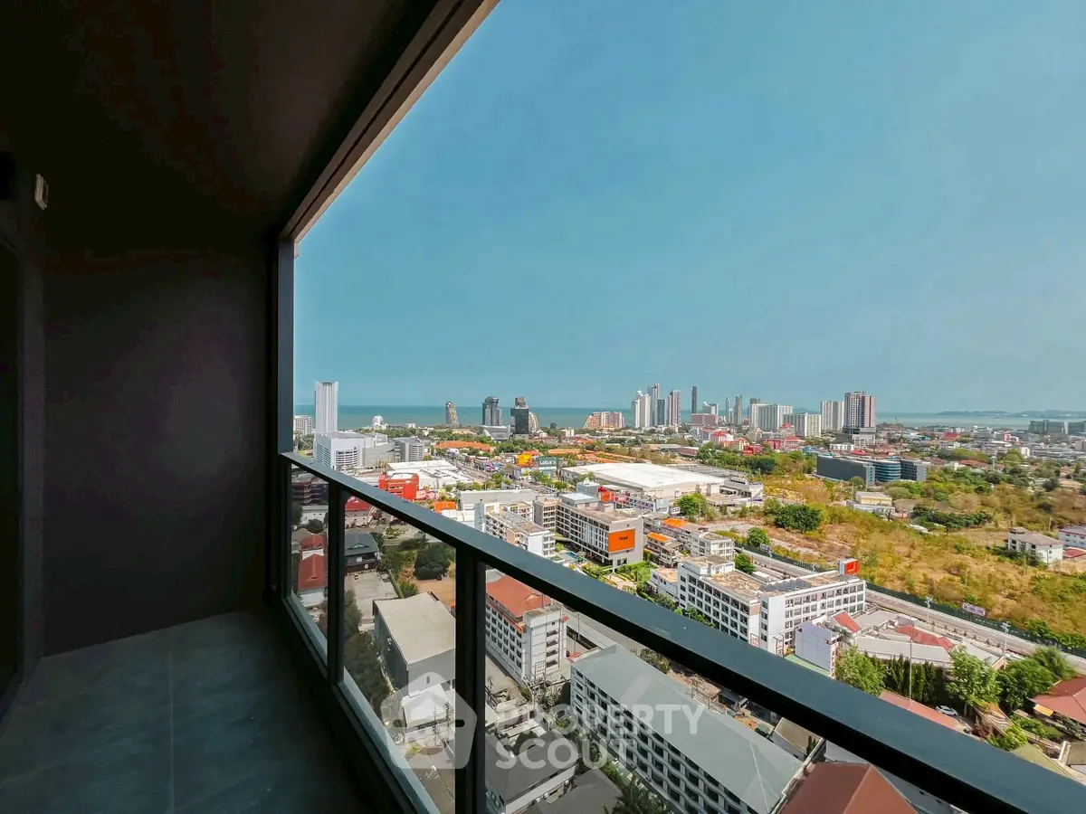 Stunning cityscape view from high-rise balcony with expansive skyline.