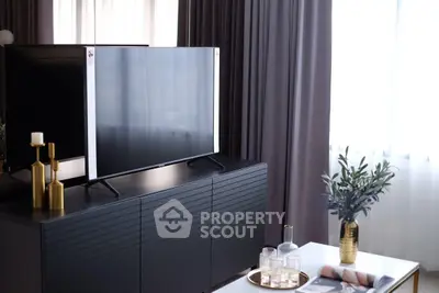 Modern living room with sleek TV and elegant decor