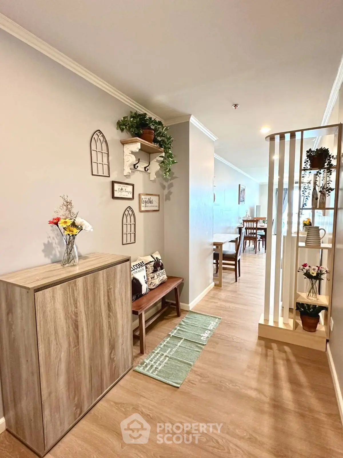 Charming interior hallway with stylish decor and wooden flooring