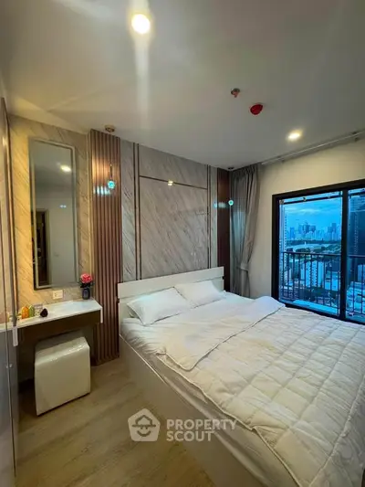 Luxurious bedroom with city view and elegant decor in modern apartment