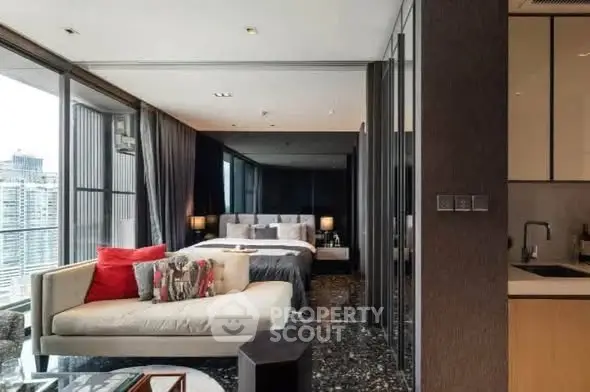 Luxurious modern apartment with open layout, featuring a stylish living area and bedroom with city views.
