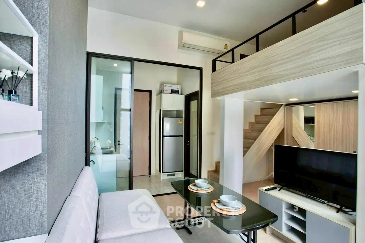 Modern loft apartment with stylish interior, featuring open living space and mezzanine level.