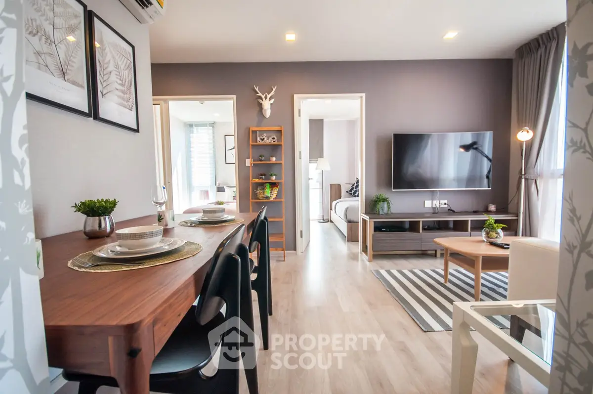 Stylish modern living room with open dining area and sleek decor