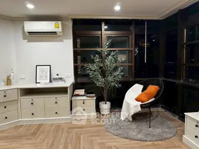 Stylish corner unit with modern decor and large windows offering city views.