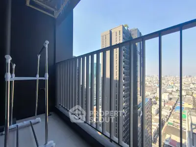 Modern high-rise balcony with stunning cityscape view, perfect for urban living.