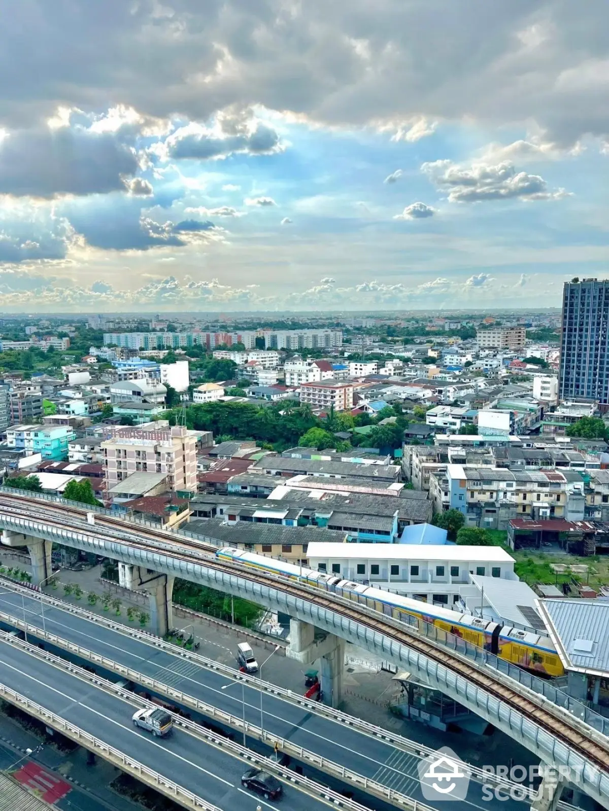 Stunning cityscape view with modern transportation and vibrant skyline, perfect for urban living enthusiasts.