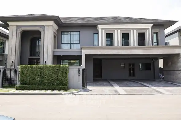 Luxurious modern two-story house with elegant facade and spacious driveway