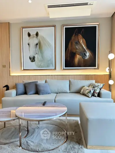 Luxurious living room with elegant decor and horse paintings