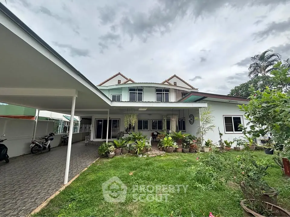 Charming suburban home with lush garden and spacious driveway, perfect for family living.