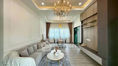 Luxurious living room with elegant chandelier and modern decor