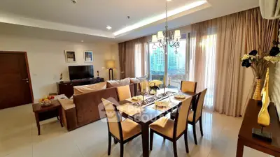 Luxurious living room with elegant dining area and city view, perfect for modern urban living.