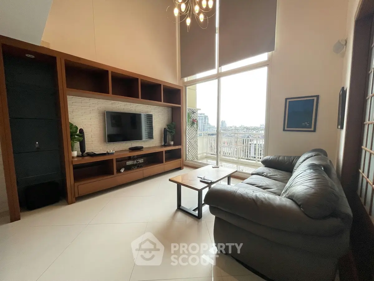 Spacious living room with modern decor and city view from large windows.