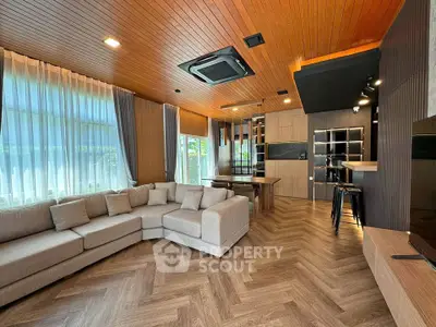 Spacious modern living room with elegant wood flooring and stylish ceiling design