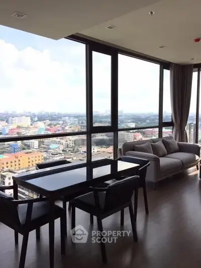 Stunning high-rise apartment with panoramic city views and elegant modern furnishings.