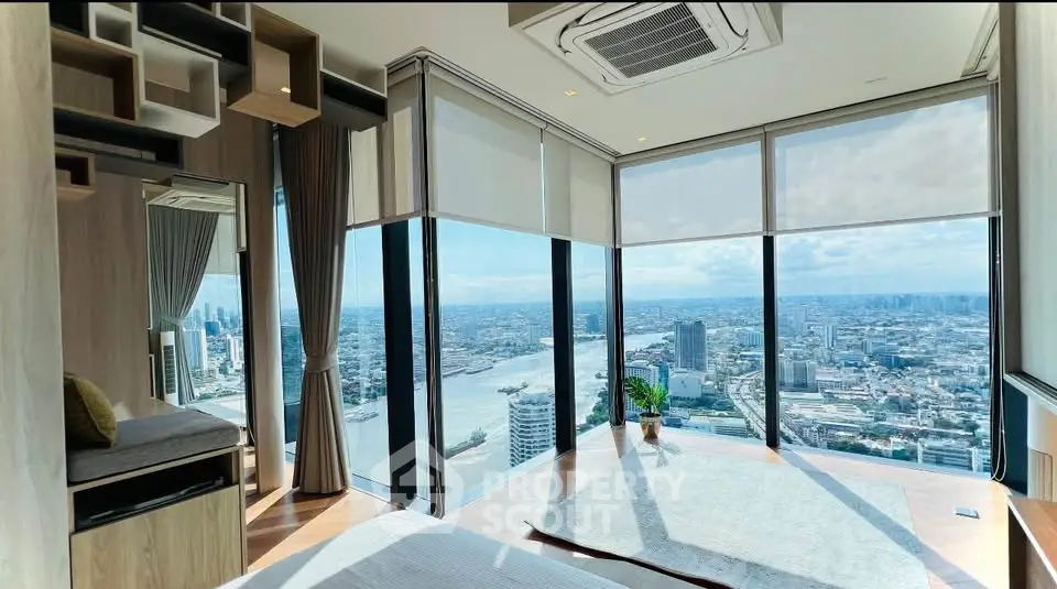 Luxurious corner unit with panoramic city and river views, featuring floor-to-ceiling windows and modern decor.