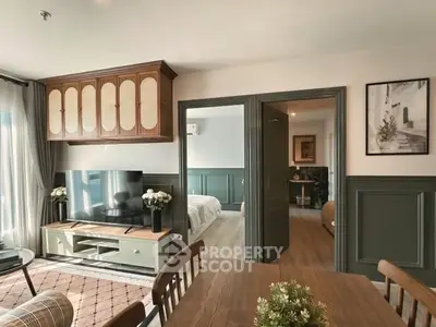 Charming living room with elegant decor and view into cozy bedroom, perfect for modern living.