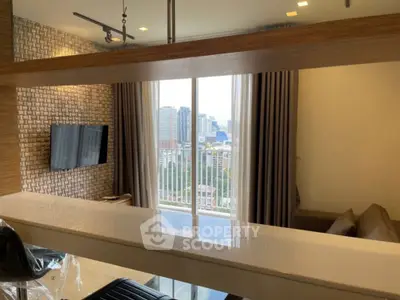 Modern living room with city view and stylish decor in high-rise apartment