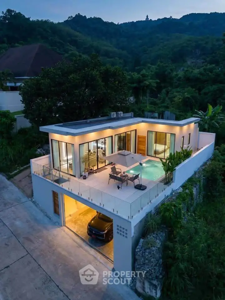 Stunning modern villa with rooftop terrace and pool nestled in lush green hills, perfect for luxury living.