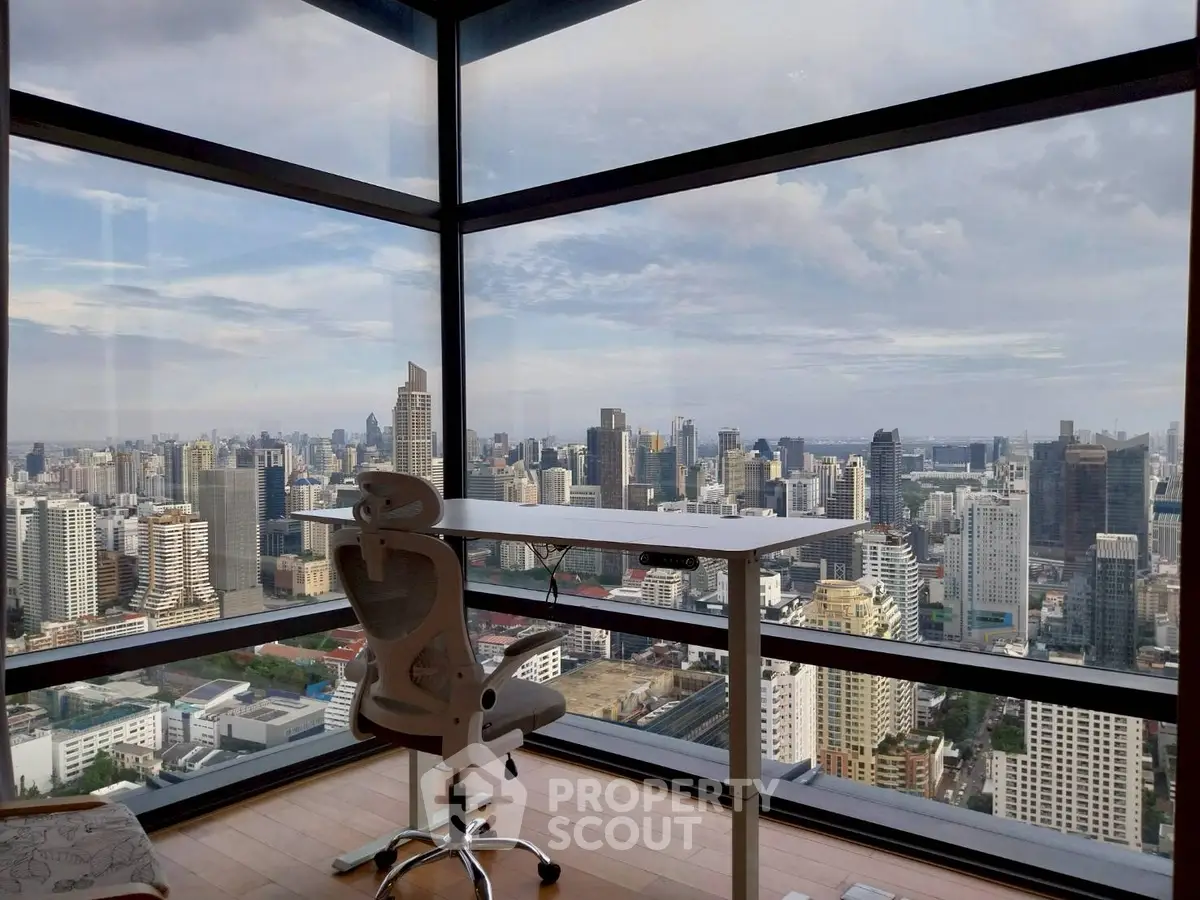 Stunning high-rise office with panoramic city skyline view, featuring modern ergonomic chair and desk.