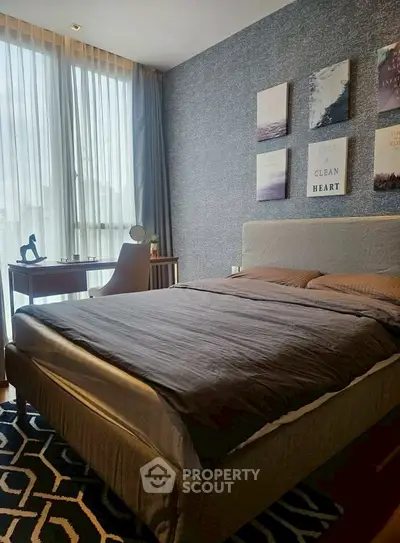 Modern bedroom with stylish decor and natural light