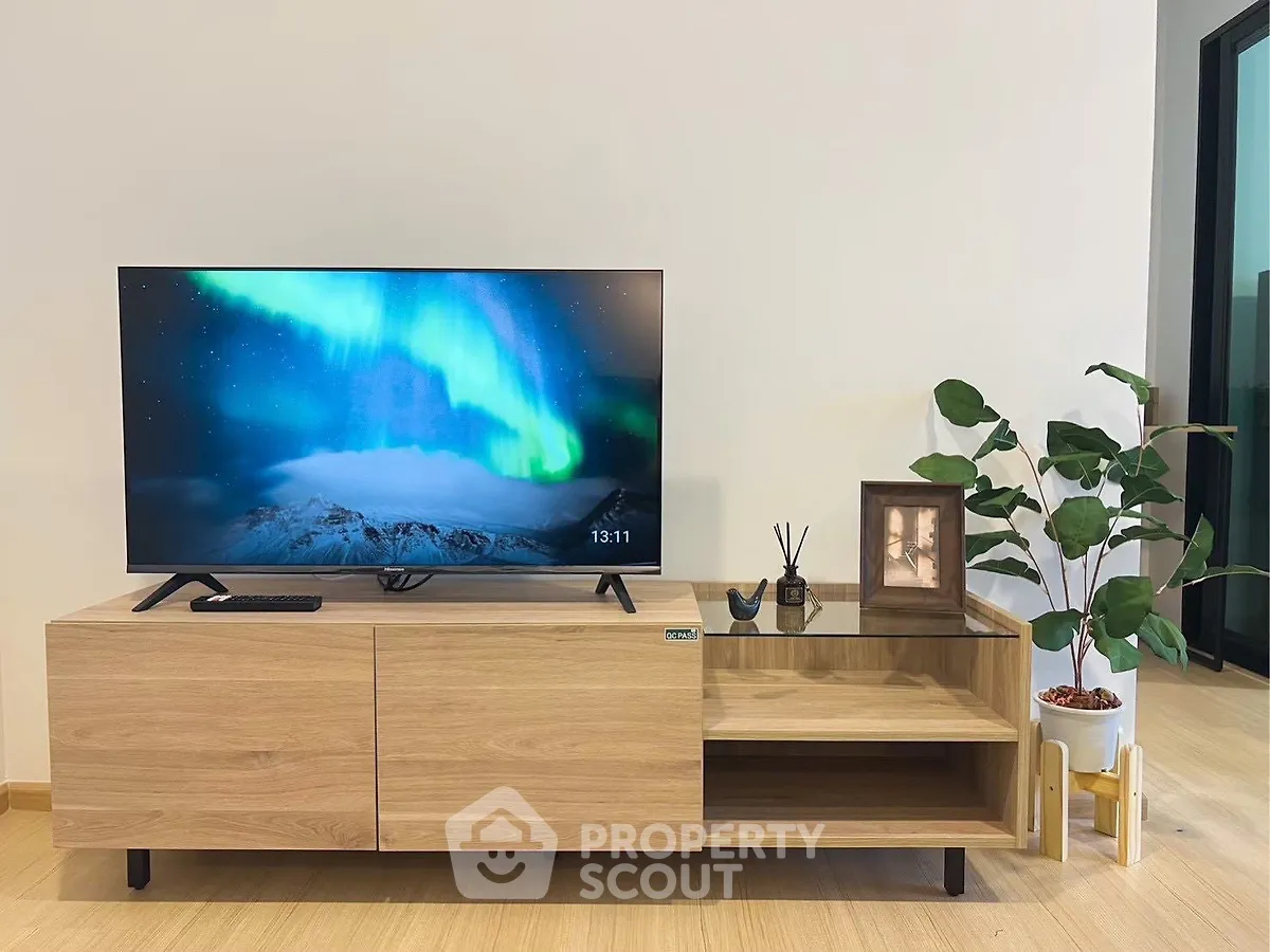 Modern living room with stylish TV stand and vibrant decor