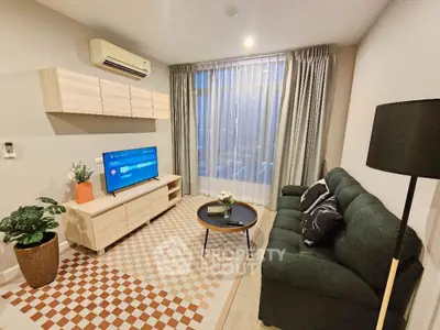 Modern living room with stylish decor, cozy sofa, and large window view.