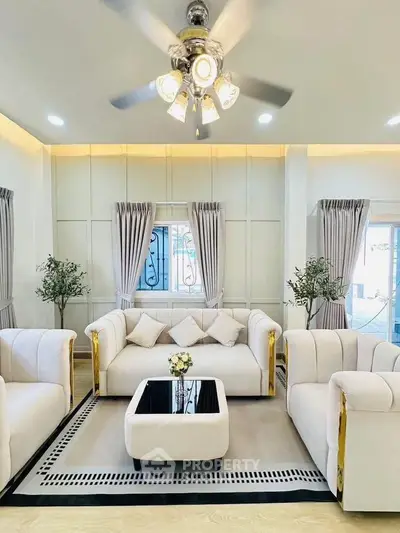 Luxurious living room with elegant white sofas and modern decor