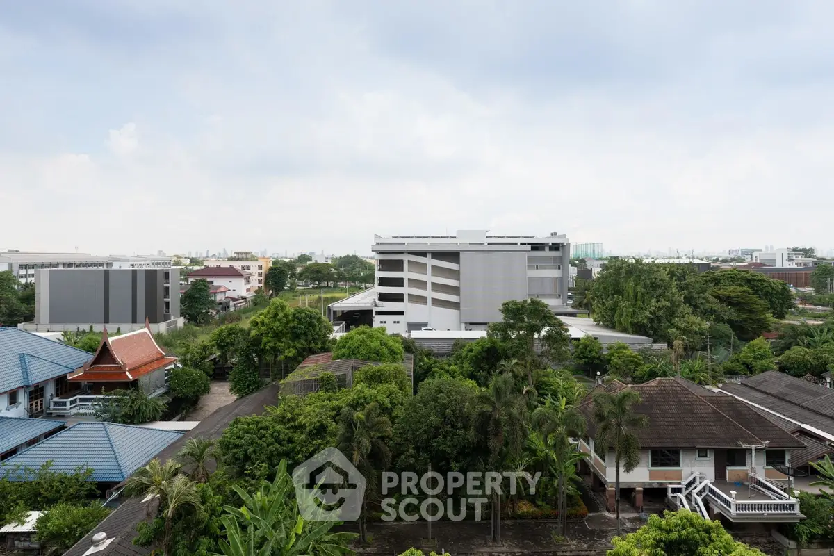 Scenic view of suburban neighborhood with lush greenery and modern buildings.
