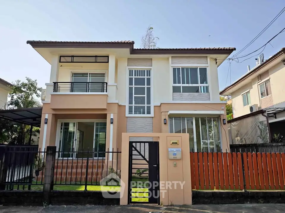 Charming two-story house with modern design and fenced yard