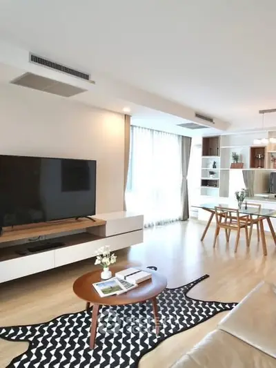 Spacious modern living room with stylish decor and natural light