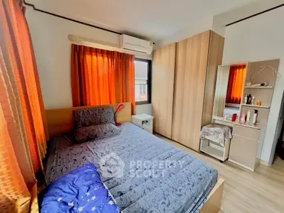 Cozy bedroom with modern wardrobe and vibrant curtains