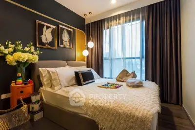 Luxurious bedroom with elegant decor and large window for natural light.