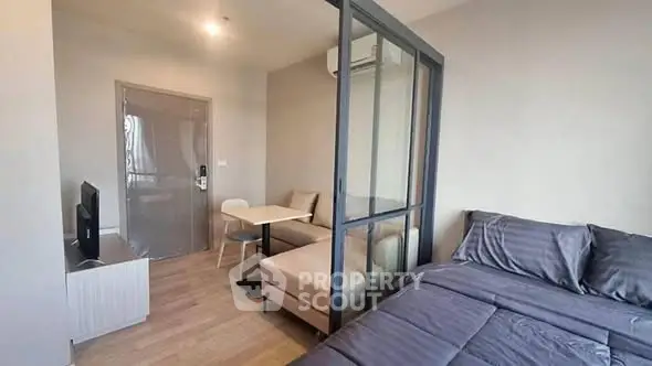 Modern studio apartment with cozy living area and stylish bedroom