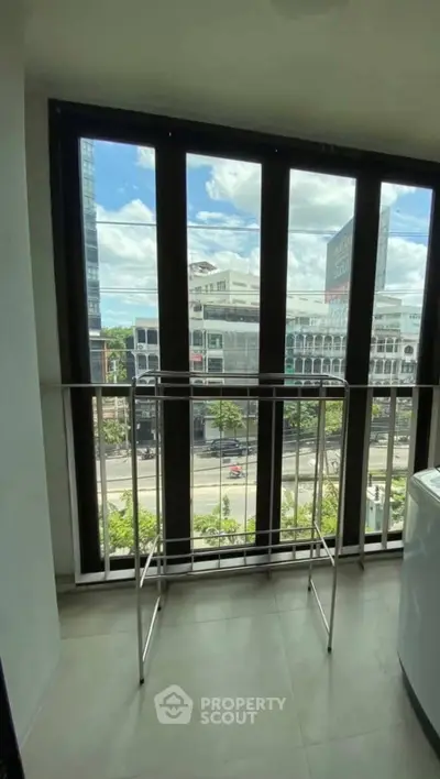 Modern balcony with city view and sleek railing, perfect for urban living.