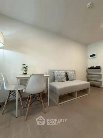 Cozy modern living room with minimalist furniture and soft lighting