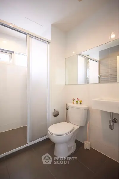 Modern bathroom with sleek design and glass shower enclosure