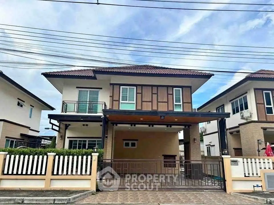 Charming two-story house with modern design and spacious driveway in a serene neighborhood.
